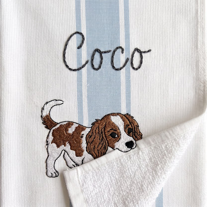 Example Cavalier King Charles Spaniel embroidery named Coco on the light blue stripe towel