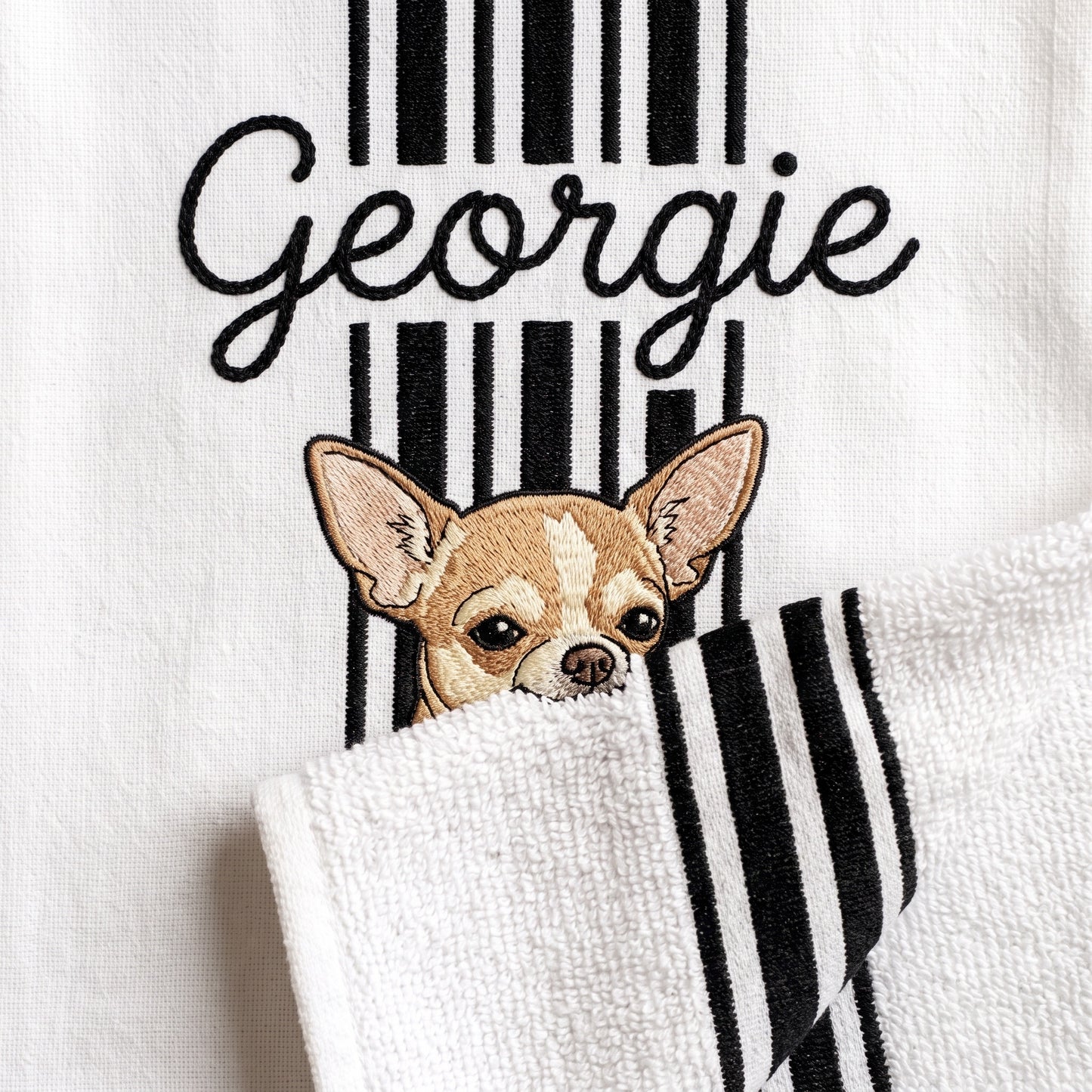 Example Chihuahua embroidery named Georgie on the black stripe towel